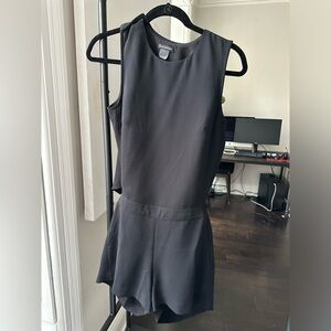 Black club Monaco short jumpsuit with open back.
